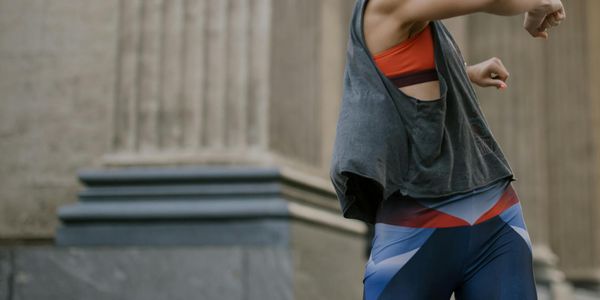 Athlete in mid-motion during a dynamic stretching routine.