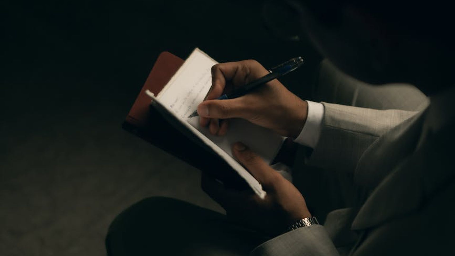 Man in a state of calm focus in a dimly lit space.